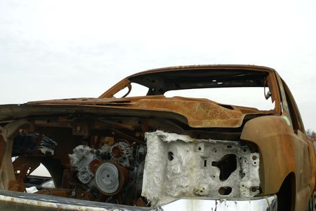 a rusty shell and engine of a truck that was in a fireの写真素材