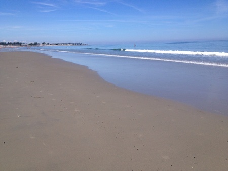 Waves at the ocean along the beach in the summer