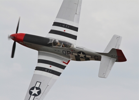 Monroe, North Carolina - November 4, 2012:  World War II P-51 Mustang Fighter Performing during Warbirds Over Monroe Air Show in Monroe, NC, on November 4, 2012.のeditorial素材