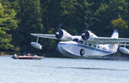 Fifield, Wisconsin - September 6, 2006:  A restored, WWII-era Grumman Goose seaplane lifts off from a lake near Fifield, WI, September 6, 2006.のeditorial素材
