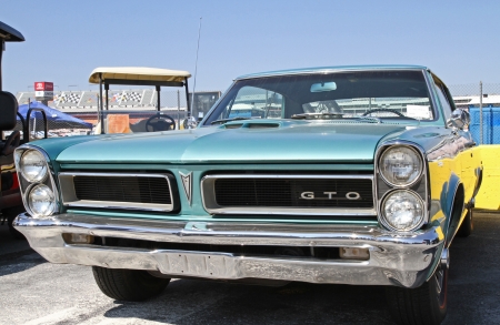 Concord, North Carolina - April 6, 2013:  A 1965 Pontiac GTO automobile on display at the Food Lion Auto Fair classic car show at Charlotte Motor Speedway in Concord, North Carolina.のeditorial素材