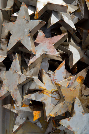 A jumble of decorative metal stars aged with rust.の写真素材