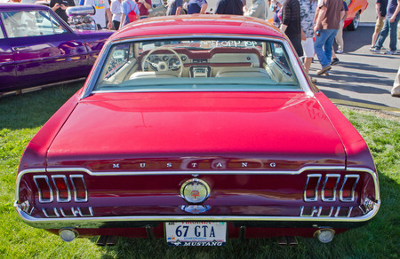 CONCORD NC - APRIL 11 2015:  A 1967 Ford Mustang GT automobile on display at the Charlotte AutoFair classic car show held at Charlotte Motor Speedway.のeditorial素材