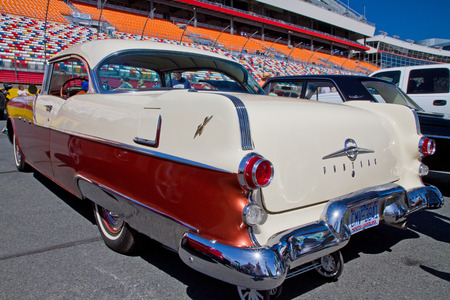 CONCORD NC - APRIL 11 2015:  A 1955 Pontiac Chieftain automobile on display at the Charlotte AutoFair classic car show held at Charlotte Motor Speedway.のeditorial素材