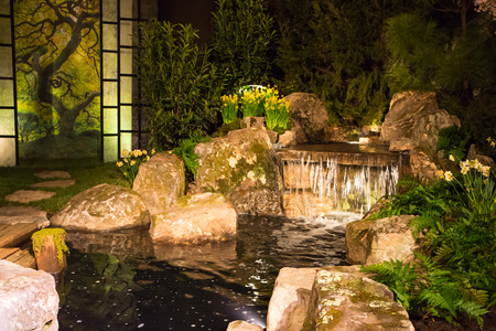 CHARLOTTE, NC- February 28, 2016:  A display of landscape architecture with dramatic night lighting at the Southern Spring Home  Garden Show.のeditorial素材