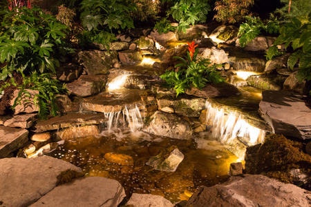 CHARLOTTE, NC - February 28, 2016:  A display of landscape architecture with dramatic night lighting at the Southern Spring Home  Garden Show.のeditorial素材