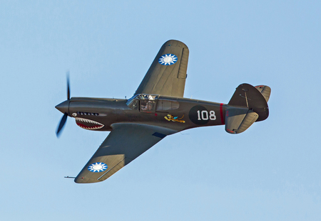 MONROE, NC - NOVEMBER 11, 2017:  A P-40 Warhawk fighter aircraft performing during the Warbirds Over Monroe Air Show in Monroe, NC.のeditorial素材