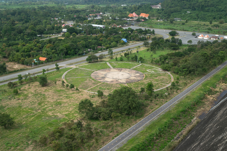 Helicopter landing port on green grass at Khundan Prakranchon dam in Thailand.の写真素材