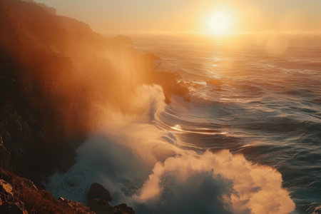 Powerful waves crash against cliffs under a misty sunset, creating a dramatic and serene coastal landscape.の素材