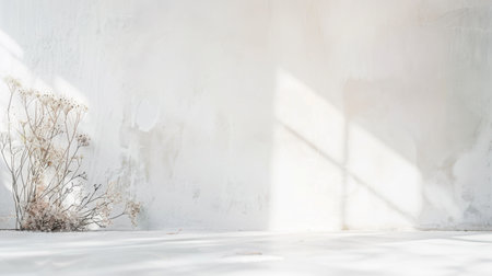 A serene minimalist interior featuring a white chaise lounge, potted plants, and decorative vases, bathed in soft sunlight and shadows.の素材