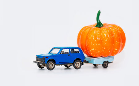 A toy car with a trailer simulates food delivery. Isolateの写真素材