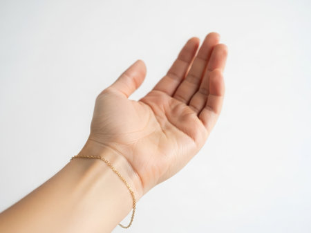 Elegant hand with delicate gold braceletの素材