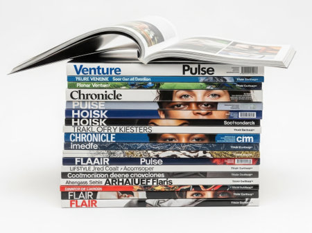 Stack of various fashion magazines with diverse covers and headlinesの素材