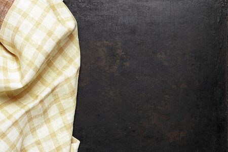 crumpled tablecloth on old rustic background