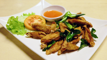 Fried chicken wings with Kaffir lime leaf.の写真素材