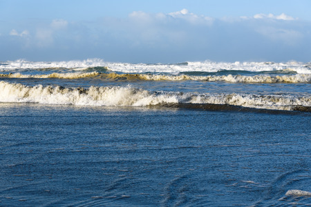 After the storm, sun on the ocean wavesの写真素材