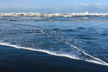 After the storm, sun on the ocean wavesの写真素材