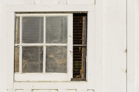 Closeup of a window in a white barnの写真素材