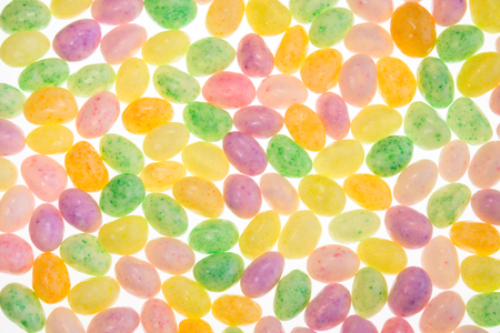 Easter jelly beans back-lit to glow in a colorful patternの写真素材