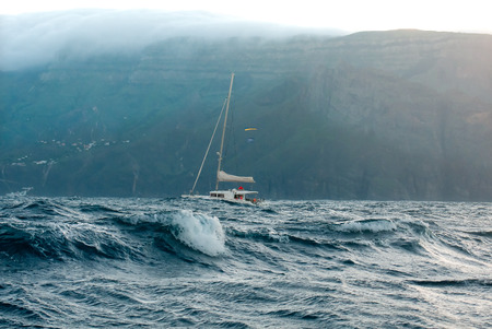Yacht catamaran in the stormy ocean near the island of La Gomera.のeditorial素材