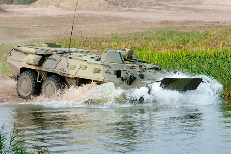 APC BTR-80 enters the water, for crossing the river.のeditorial素材