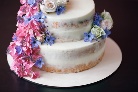 Cake with flowers decor on black table. indoorの写真素材
