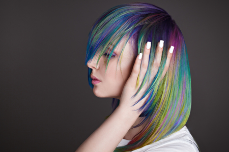 Colored straight hairs. Portrait of beautiful women with flying hairs. Ombre. Gradient. Copy-space. White manicure designの写真素材