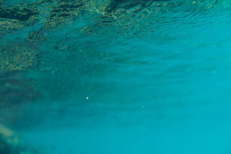 Blue underwater bokeh ,light particles Abstract