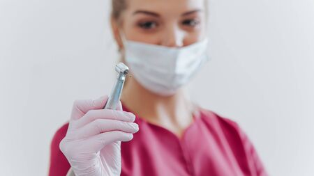 dental instrument in dentist hand in dental office. Indoor. Stomatologyの写真素材