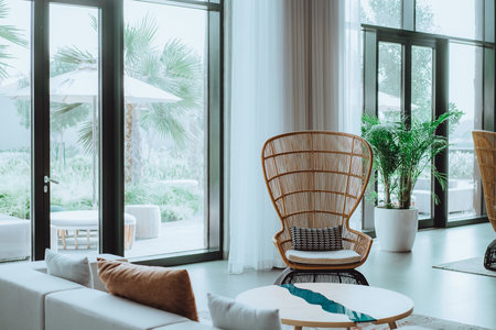 Tropical interior with palm trees, natural materials, beige tonesの写真素材