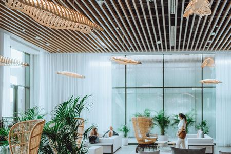Tropical interior with palm trees, natural materials, beige tonesの写真素材