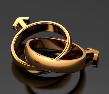 Two gold rings in the form of gender symbolsの写真素材