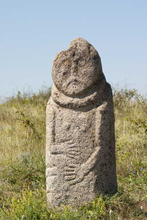 Scythian stone idol Kurgan stelae "Babah" in the steppe. National steppe reserve "Stone barrows", Donetsk region, Ukraineの写真素材