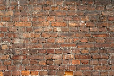 The facade view of the old brick wall for design backgroundの写真素材