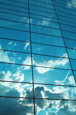 Reflexion of the sky and clouds in mirror glassesの写真素材