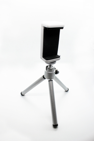 A mobile stand. A white mobile stand.の写真素材