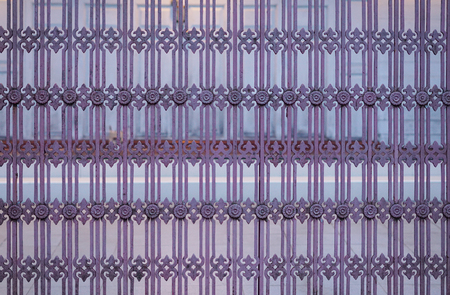 Purple steel fence of warm house background.の写真素材