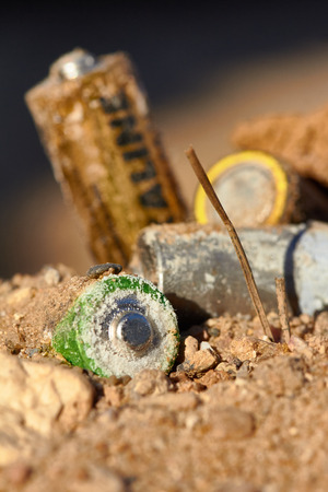 Exhaust alkaline batteries improperly thrown away, not recycled and are poisoning the land.の写真素材