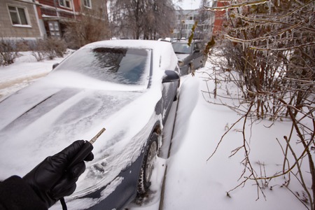 Car is covered icicles, snow and ice. Cleaning of snowdrift. Access problems.の写真素材