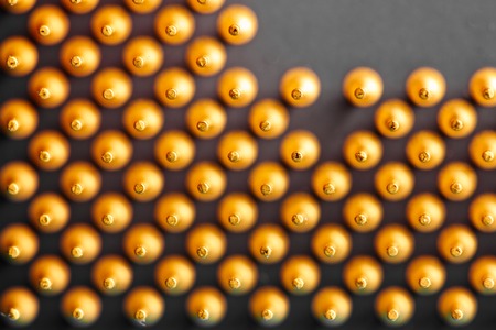 The micro elements of computer central processor unit, CPU contact pins close up.