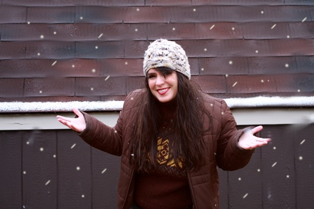 Happy Woman Playing in Snowの写真素材