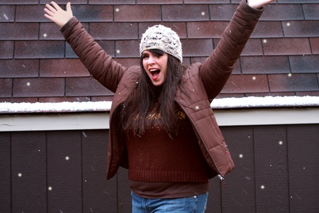 Pretty Woman Excited Playing in Snowの写真素材