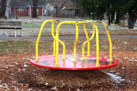 Merry Go Round in Park Snowing in Winter Outdoorsの写真素材