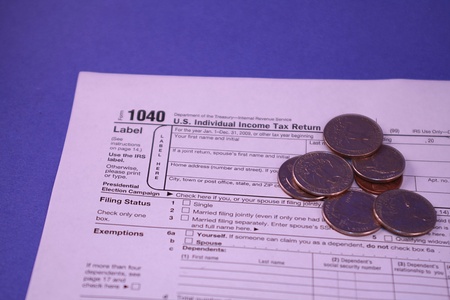 1040 Tax Form on Blue Backgroundの写真素材