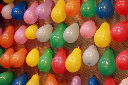 Balloons placed on a wall create joyful moodの写真素材