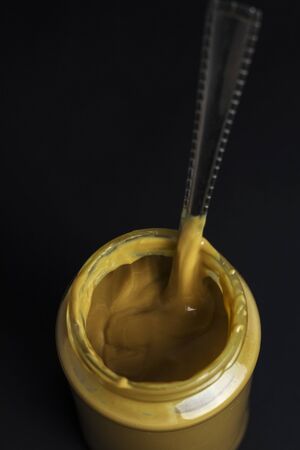 fresh peanut butter on black background