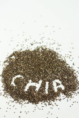 Chia seeds close on white background. Top viewの写真素材