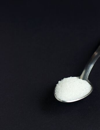 sugar on black backgroundの写真素材