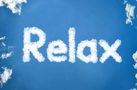 Relax written in cloudsの写真素材