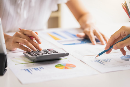 Business people meeting to analyze and discuss the situation on the financial report in meeting room. Meeting planning budget and cost. Business financial analysis and strategy concept.の写真素材